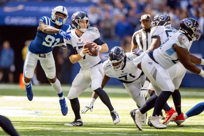 Oct 2, 2022; Indianapolis, Indiana, USA; Tennessee Titans quarterback Ryan Tannehill (17) narrowly misses being sacked by Indianapolis Colts defensive end Yannick Ngakoue (91) during the first quarter at Lucas Oil Stadium.